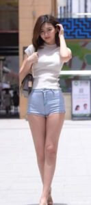 White sweater with light blue jeans